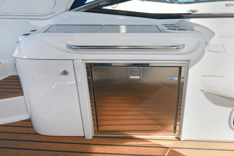 Slide: The Image of 2010 Formula 350 SS yacht kitchenette with stainless steel fridge and wooden flooring. - 30