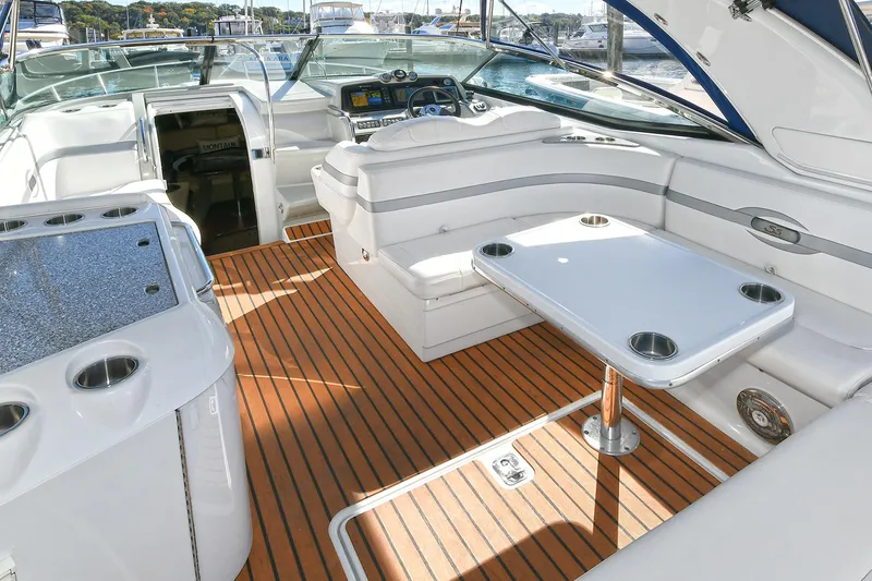 Slide: The Image of Luxurious 2010 Formula 350 SS boat interior with sleek seating and wooden flooring. - 38