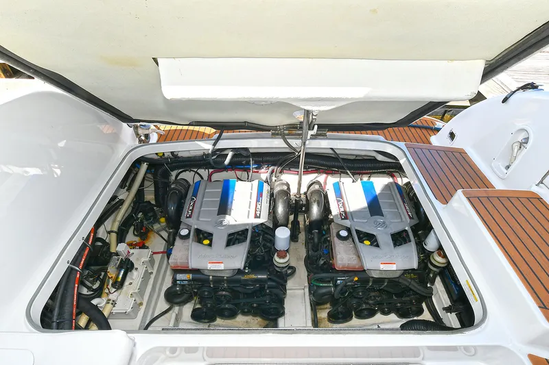 Slide: The Image of Engine compartment of a 2010 Formula 350 SS boat, showcasing dual engines. - 44