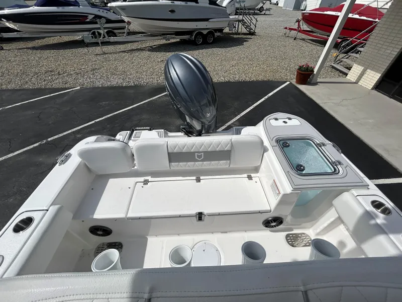 Slide: The Image of 2025 Sea Fox 228 Commander boat interior with seating and storage compartments. - 11