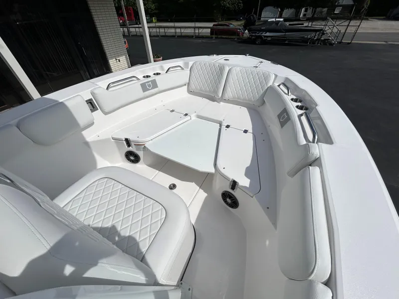 Slide: The Image of 2025 Sea Fox 228 Commander boat interior with white seating and modern design. - 12