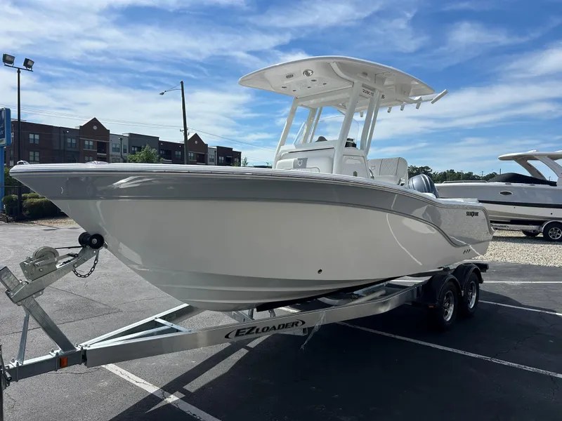 Slide: The Image of 2025 Sea Fox 228 Commander boat on trailer in parking lot. - 3