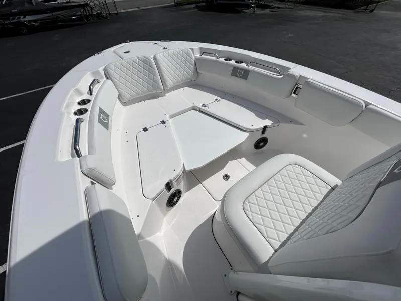 Slide: The Image of 2025 Sea Fox 228 Commander boat interior with white cushioned seating. - 9