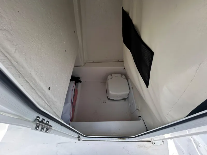 Slide: The Image of 2024 Sea Fox 228 Commander boat interior with compact toilet. - 13