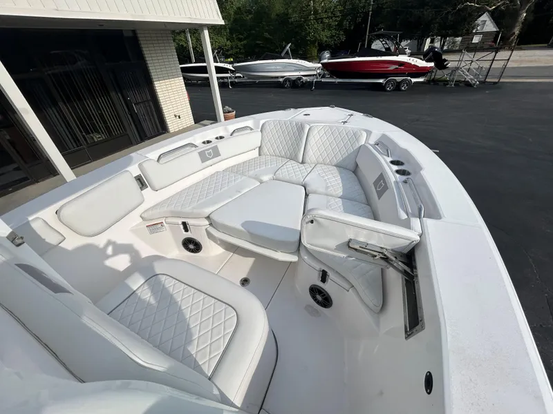 Slide: The Image of 2024 Sea Fox 228 Commander boat interior with white cushioned seating and modern design. - 17