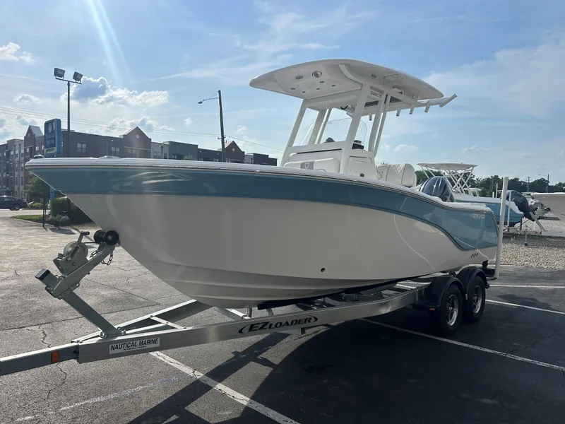 Slide: The Image of 2024 Sea Fox 228 Commander boat on trailer in parking lot, sunny day. - 3