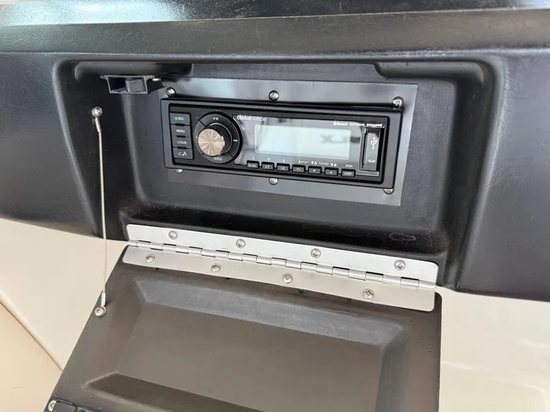 Slide: The Image of Boat stereo system in a 2010 Sea Ray 250 SLX dashboard compartment. - 38