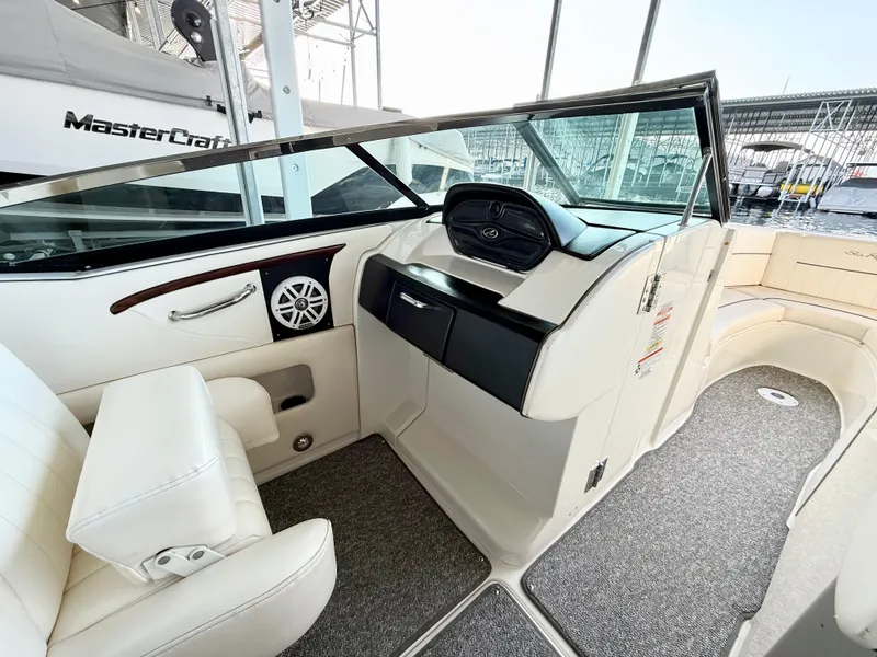 Slide: The Image of Interior of 2010 Sea Ray 250 SLX boat with white seating and dashboard. - 47