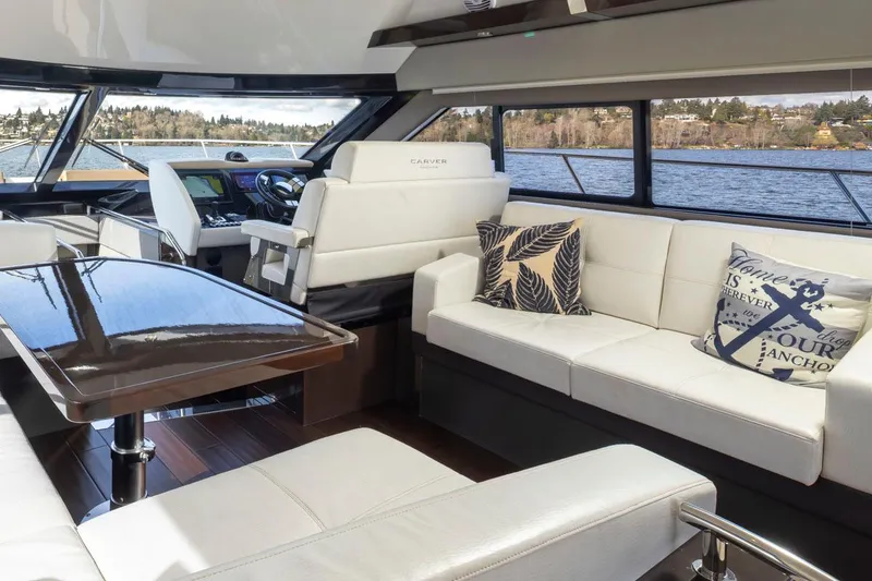 Slide: The Image of Luxurious interior of 2019 Carver C52 Command Bridge yacht with plush seating and scenic views. - 22