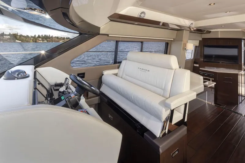 Slide: The Image of Interior of 2019 Carver C52 Command Bridge yacht with luxurious seating and modern design. - 23