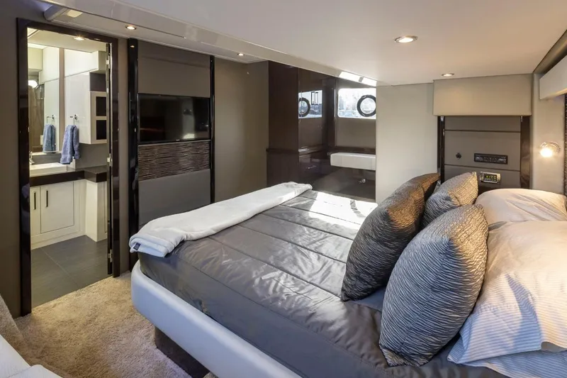 Slide: The Image of Luxurious bedroom interior of 2019 Carver C52 Command Bridge yacht with modern amenities. - 27