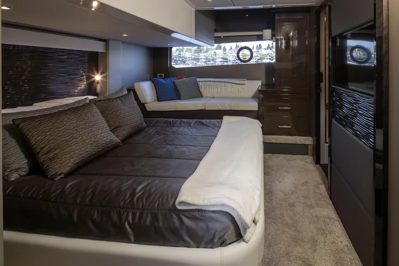 Slide: The Image of Luxurious bedroom interior of 2019 Carver C52 Command Bridge yacht with modern furnishings. - 28