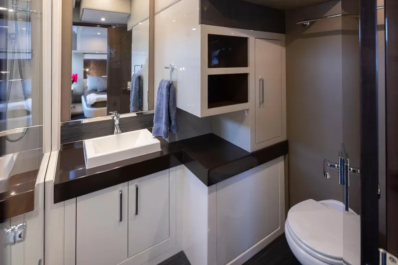 Slide: The Image of Luxurious bathroom interior of 2019 Carver C52 Command Bridge yacht, featuring modern fixtures and elegant design. - 30