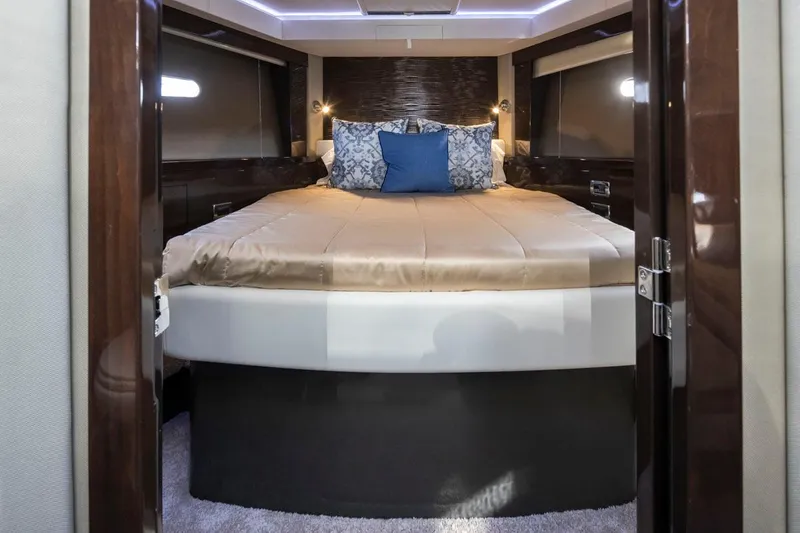 Slide: The Image of Luxurious bedroom interior of 2019 Carver C52 Command Bridge yacht with elegant bedding. - 33