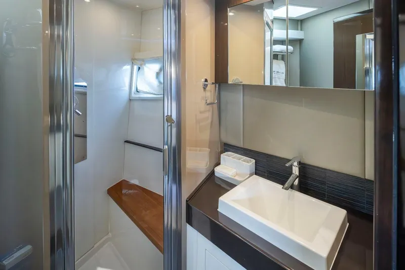 Slide: The Image of Luxurious bathroom in 2019 Carver C52 Command Bridge yacht with modern fixtures and sleek design. - 35