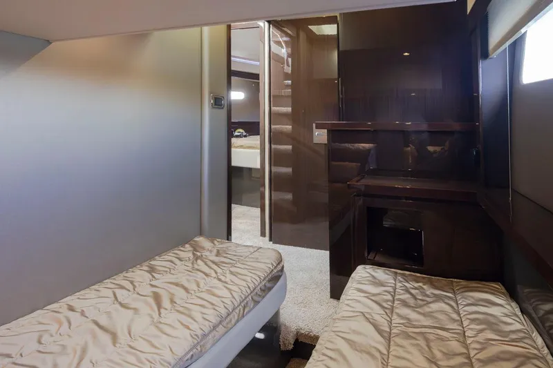 Slide: The Image of Interior of 2019 Carver C52 Command Bridge with twin beds and modern design. - 39