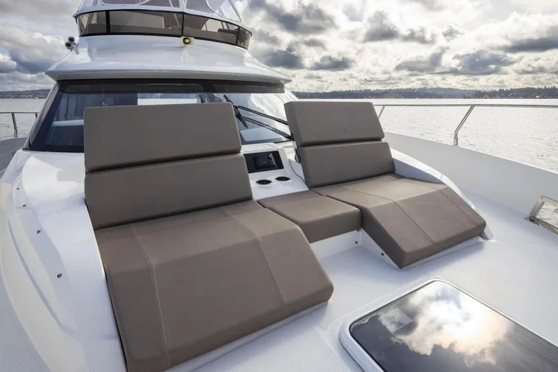 Slide: The Image of 2019 Carver C52 Command Bridge yacht with luxurious deck seating. - 45