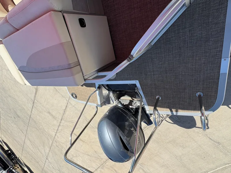 Slide: The Image of 2015 Bennington 21 SLX SPS pontoon boat with motor and seating area. - 14