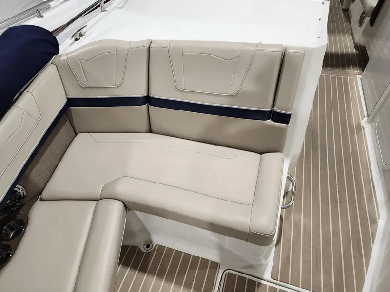 Slide: The Image of 2018 Formula 350 CBR boat interior with beige seating and striped flooring. - 10