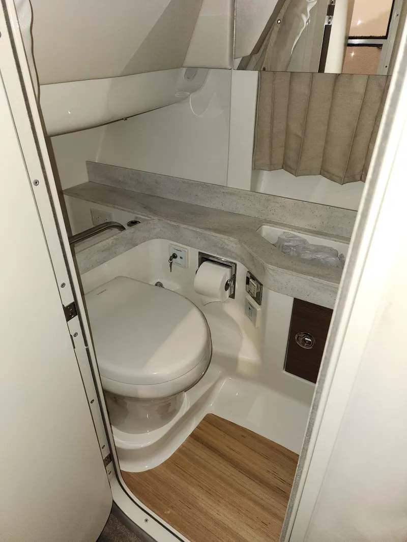 Slide: The Image of 2018 Formula 350 CBR boat bathroom with modern fixtures and wood flooring. - 15