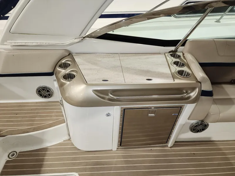 Slide: The Image of 2018 Formula 350 CBR boat interior with kitchenette and cup holders. - 25