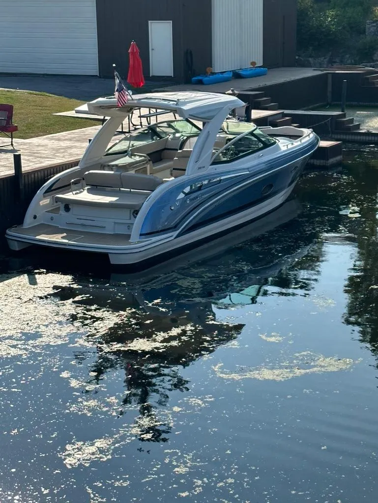 Slide: The Image of 2018 Formula 350 CBR boat docked in a calm, reflective waterway. - 3