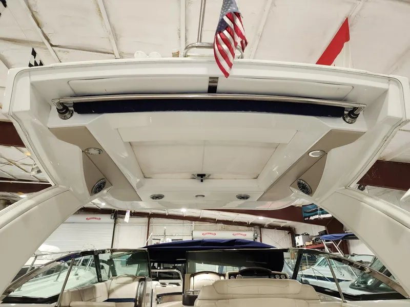 Slide: The Image of 2018 Formula 350 CBR boat interior with American flag, viewed from below in a storage facility. - 7