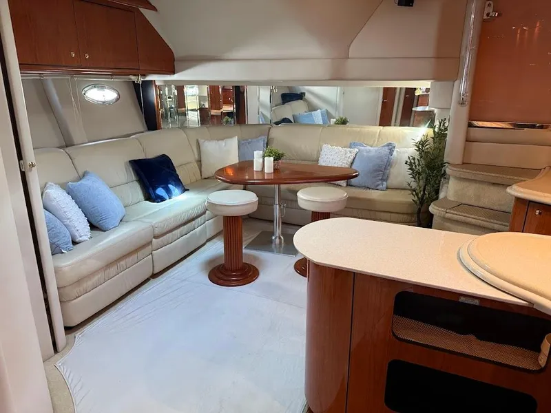 Slide: The Image of Luxurious interior of 2000 Sea Ray 510 Sundancer yacht with plush seating and elegant decor. - 14
