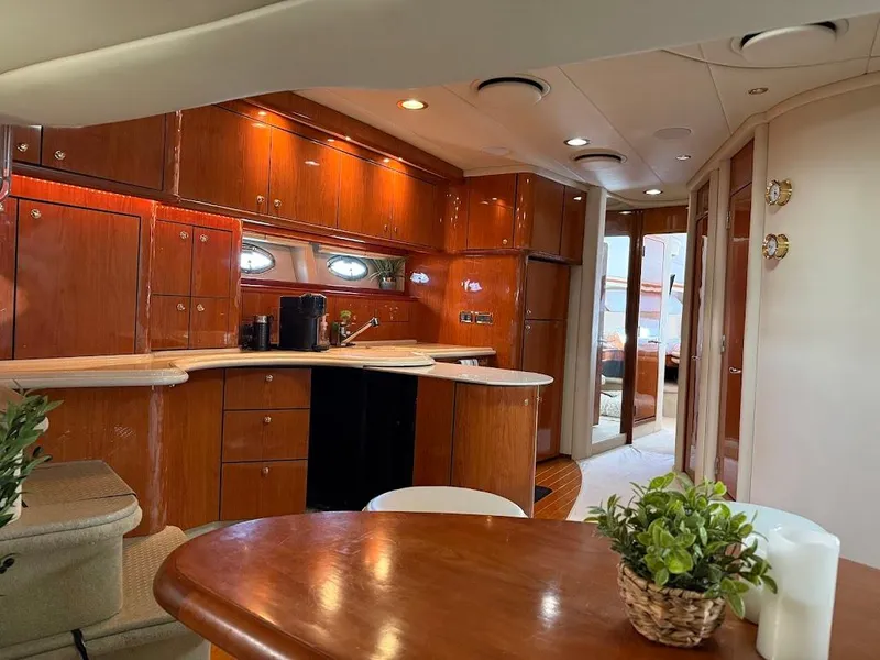 Slide: The Image of Interior of 2000 Sea Ray 510 Sundancer yacht with elegant wood cabinetry and modern amenities. - 17