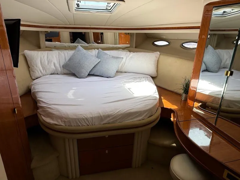 Slide: The Image of Luxurious cabin interior of 2000 Sea Ray 510 Sundancer yacht with cozy bed and elegant decor. - 27