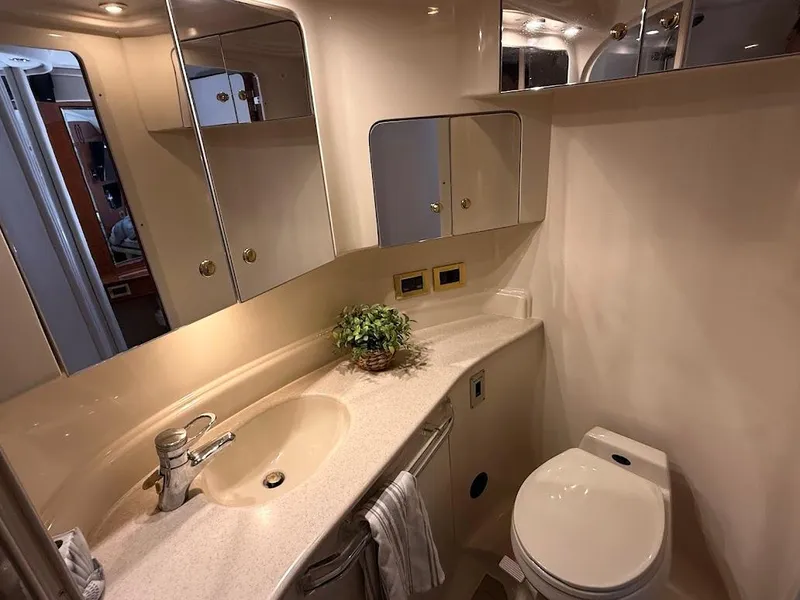 Slide: The Image of Luxurious bathroom in 2000 Sea Ray 510 Sundancer yacht with modern fixtures and elegant design. - 32