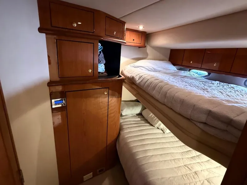 Slide: The Image of Cabin interior of 2000 Sea Ray 510 Sundancer with wooden cabinets and bunk beds. - 35