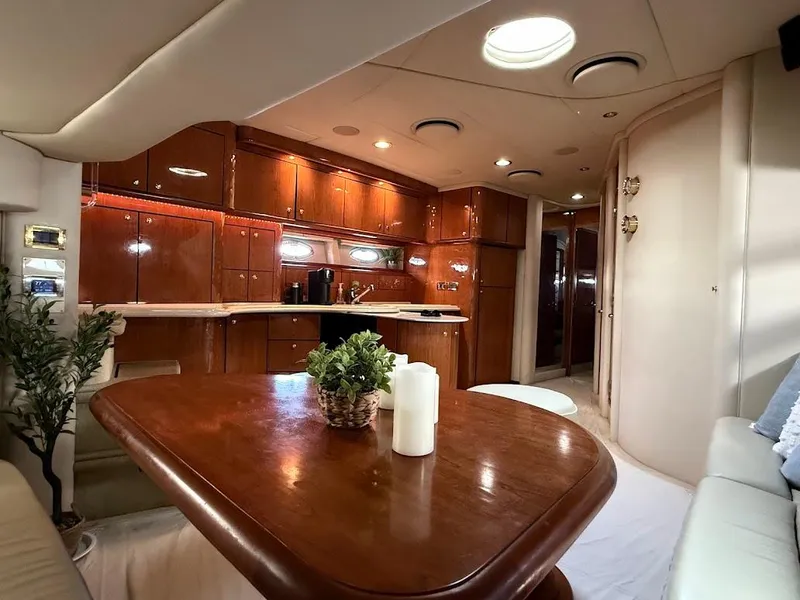 Slide: The Image of Luxurious interior of 2000 Sea Ray 510 Sundancer yacht with elegant wood finishes. - 36