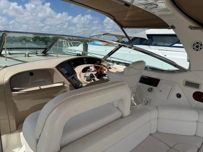 Slide: The Image of 2000 Sea Ray 510 Sundancer yacht cockpit with luxurious seating and modern controls. - 8