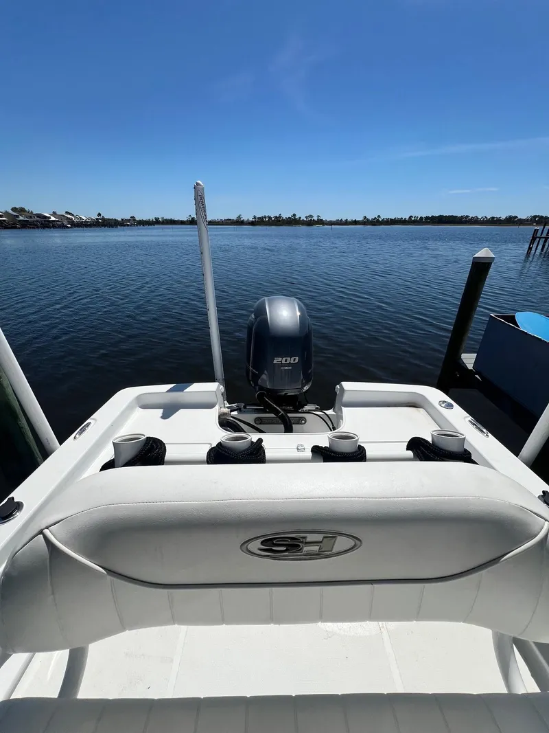 Slide: The Image of 2015 Sea Hunt BX 22 BR boat with outboard motor on calm water. - 23