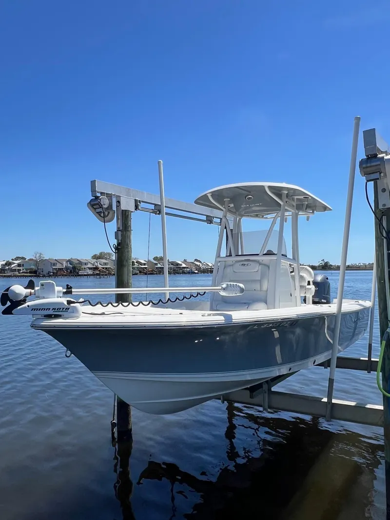 Slide: The Image of 2015 Sea Hunt BX 22 BR boat docked on a sunny day. - 29