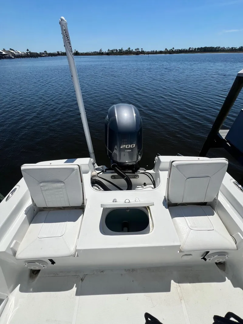 Slide: The Image of 2015 Sea Hunt BX 22 BR boat with outboard motor on calm water. - 5