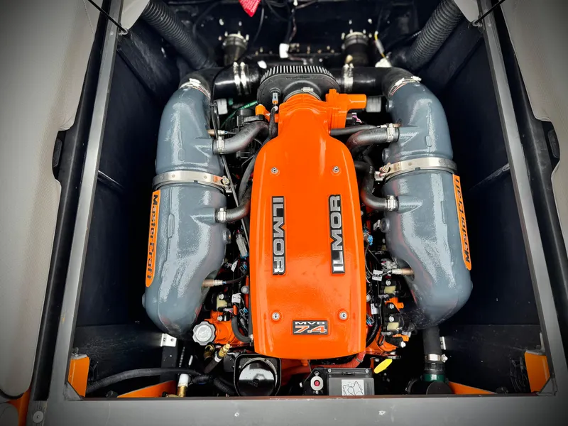 Slide: The Image of 2015 MasterCraft XStar Ilmor engine, vibrant orange, detailed view. - 41