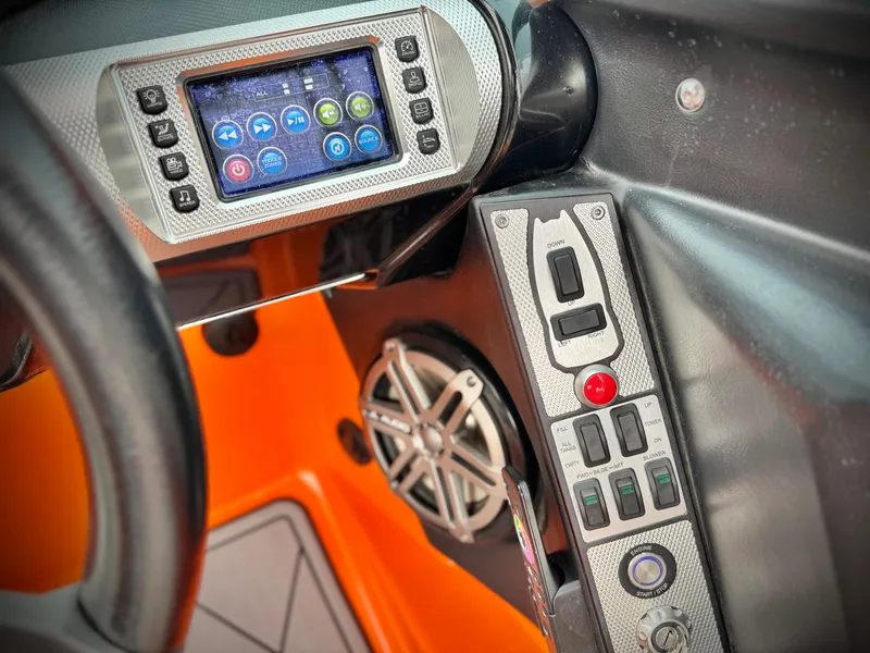 Slide: The Image of Control panel of a 2015 MasterCraft XStar boat with touchscreen and speaker. - 48