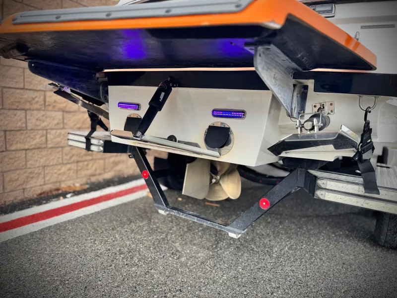 Slide: The Image of 2015 MasterCraft XStar boat stern with propeller and underwater lights. - 7