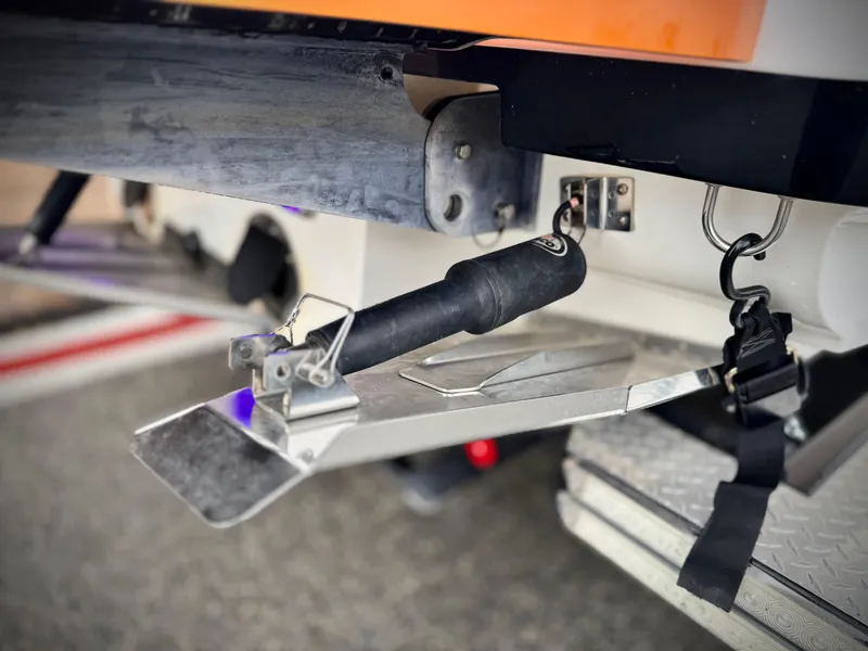 Slide: The Image of Rear view of a 2015 MasterCraft XStar boat with metal components and straps. - 8