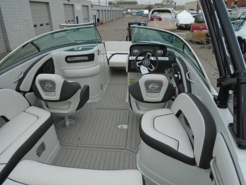 Slide: The Image of 2024 Crownline E 240 XS boat interior with modern seating and dashboard. - 6