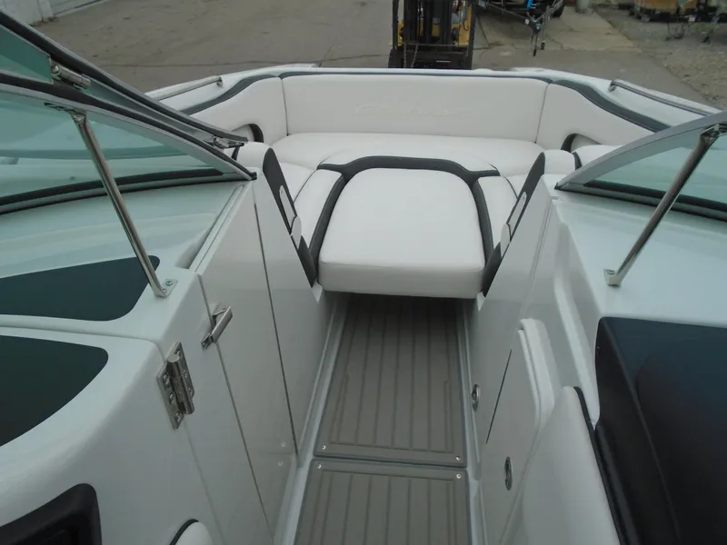 Slide: The Image of 2024 Crownline E 240 XS boat interior with white seating and sleek design. - 7