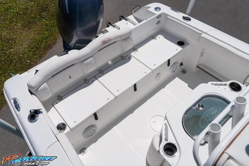 Slide: The Image of 2019 Sea Hunt Ultra 234 boat interior with seating and storage compartments. - 16