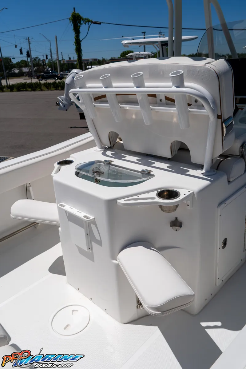 Slide: The Image of 2019 Sea Hunt Ultra 234 boat interior with seating and storage features. - 19
