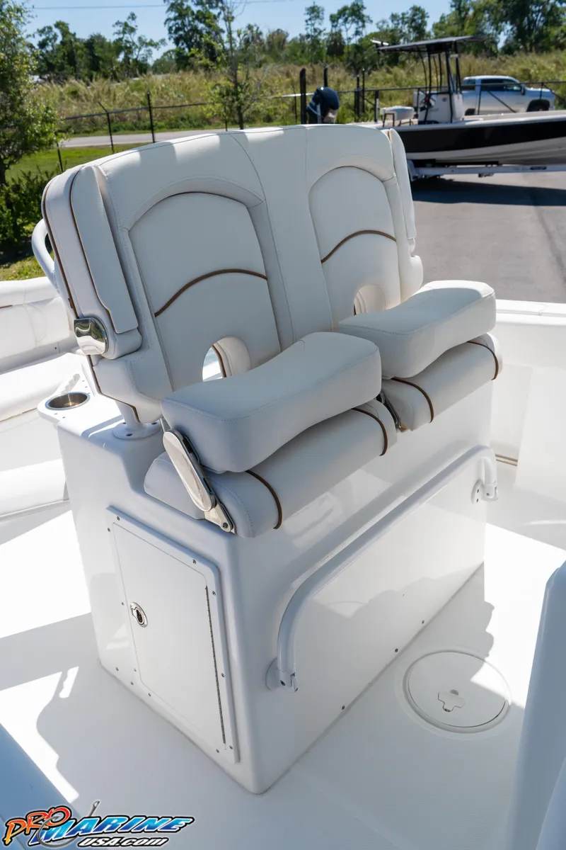 Slide: The Image of 2019 Sea Hunt Ultra 234 boat seating with white cushioned dual seats. - 23