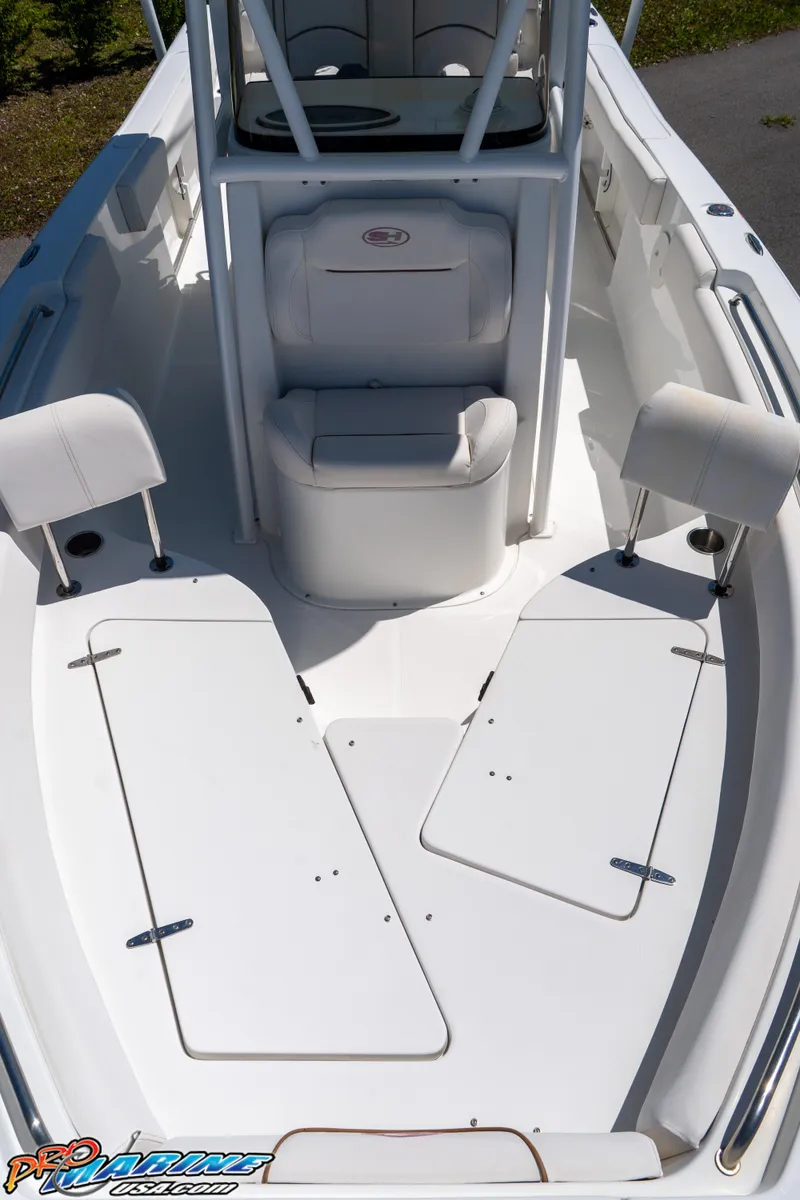Slide: The Image of 2019 Sea Hunt Ultra 234 boat interior with seating and storage compartments. - 29
