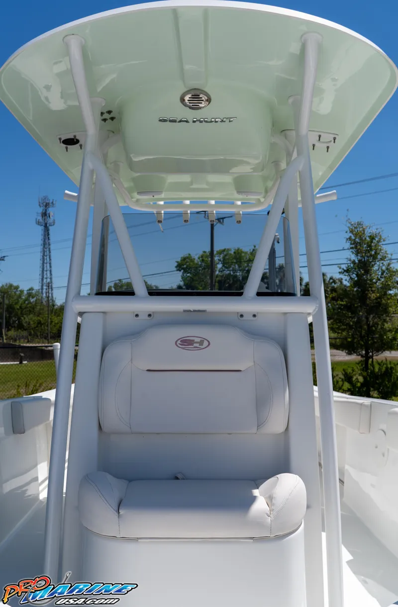 Slide: The Image of 2019 Sea Hunt Ultra 234 boat interior with seating and canopy. - 31