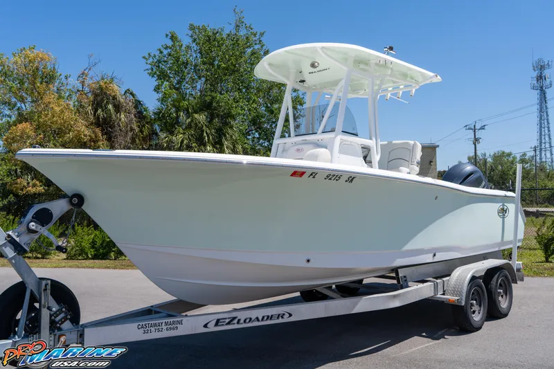Slide: The Image of 2019 Sea Hunt Ultra 234 boat on trailer, parked outdoors. - 5