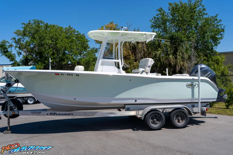 Slide: The Image of 2019 Sea Hunt Ultra 234 boat on trailer, parked outdoors. - 6